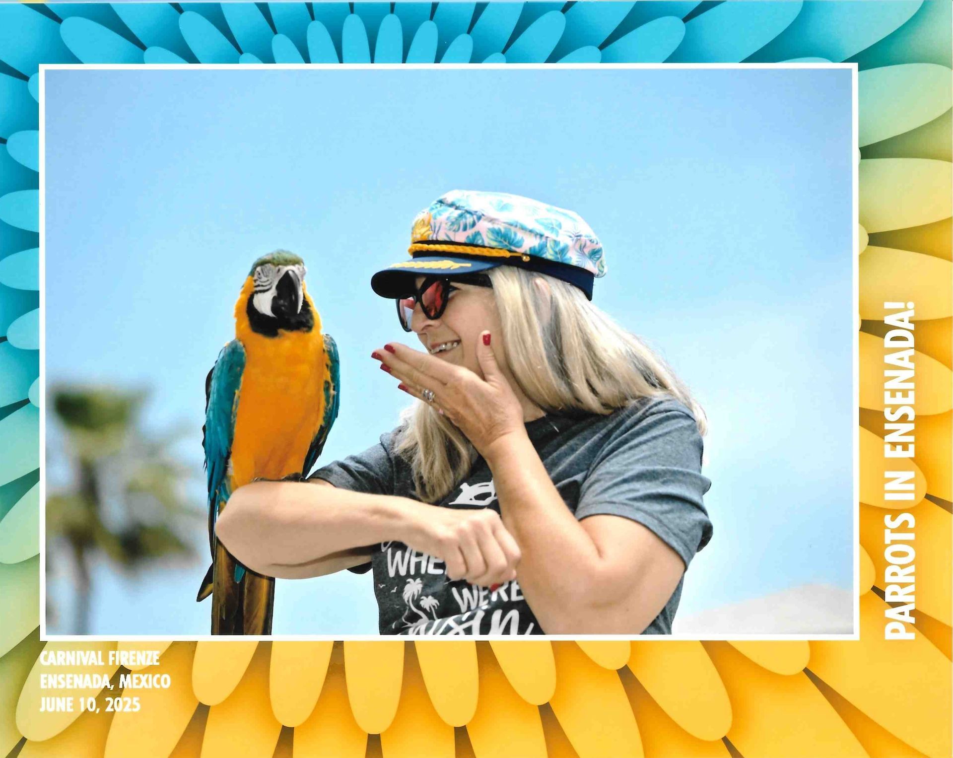 Woman with blue-and-yellow macaw on her arm, smiling in a bright tropical setting