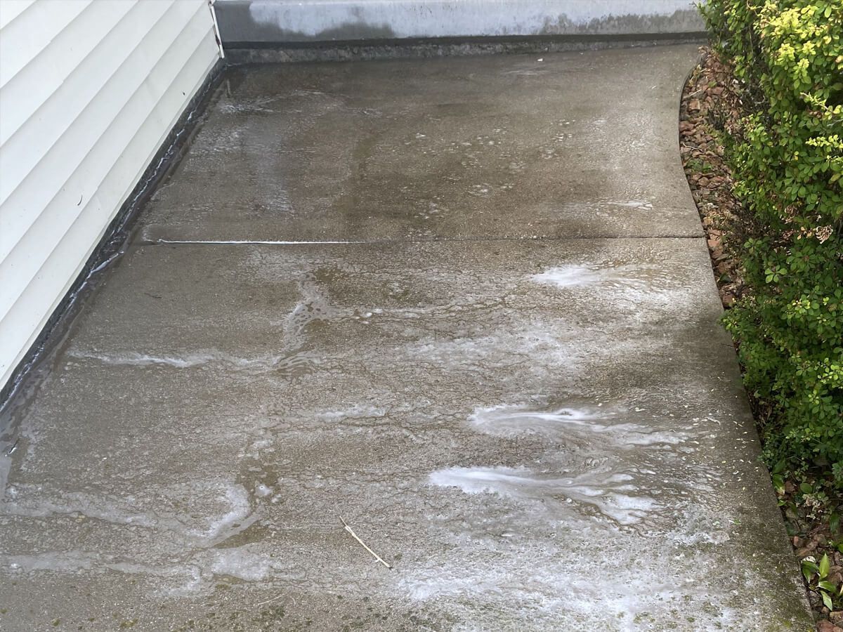 a dirty concrete walkway