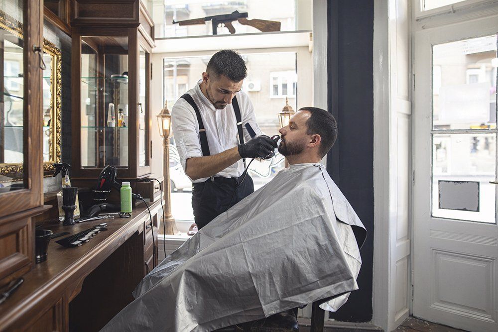 Barber Trimming Customer's Beard | Cheyenne, WY | City Barbers & Stylists