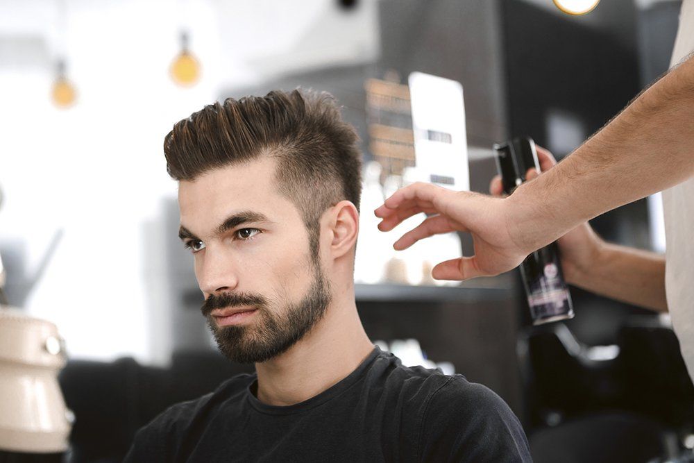 Hairdresser Spraying Man Hair | Cheyenne, WY | City Barbers & Stylists