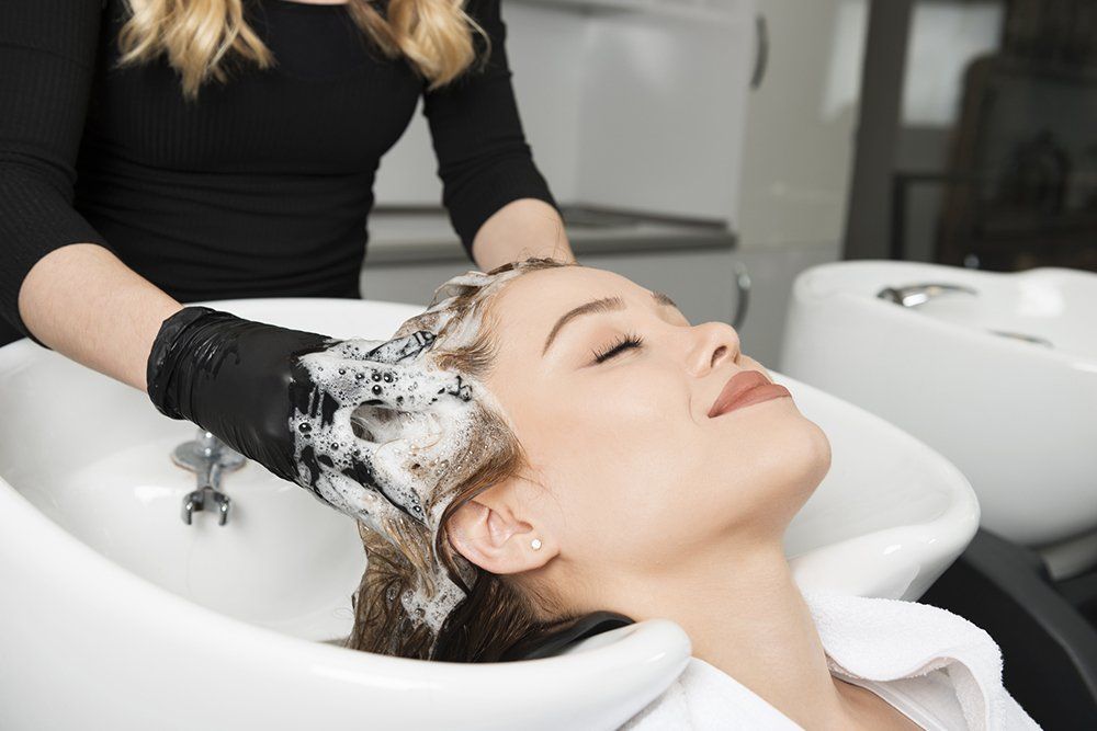 Woman is Having a Hair Wash | Cheyenne, WY | City Barbers & Stylists