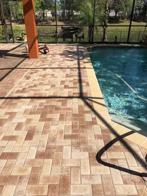 A large blue swimming pool with stairs leading to it