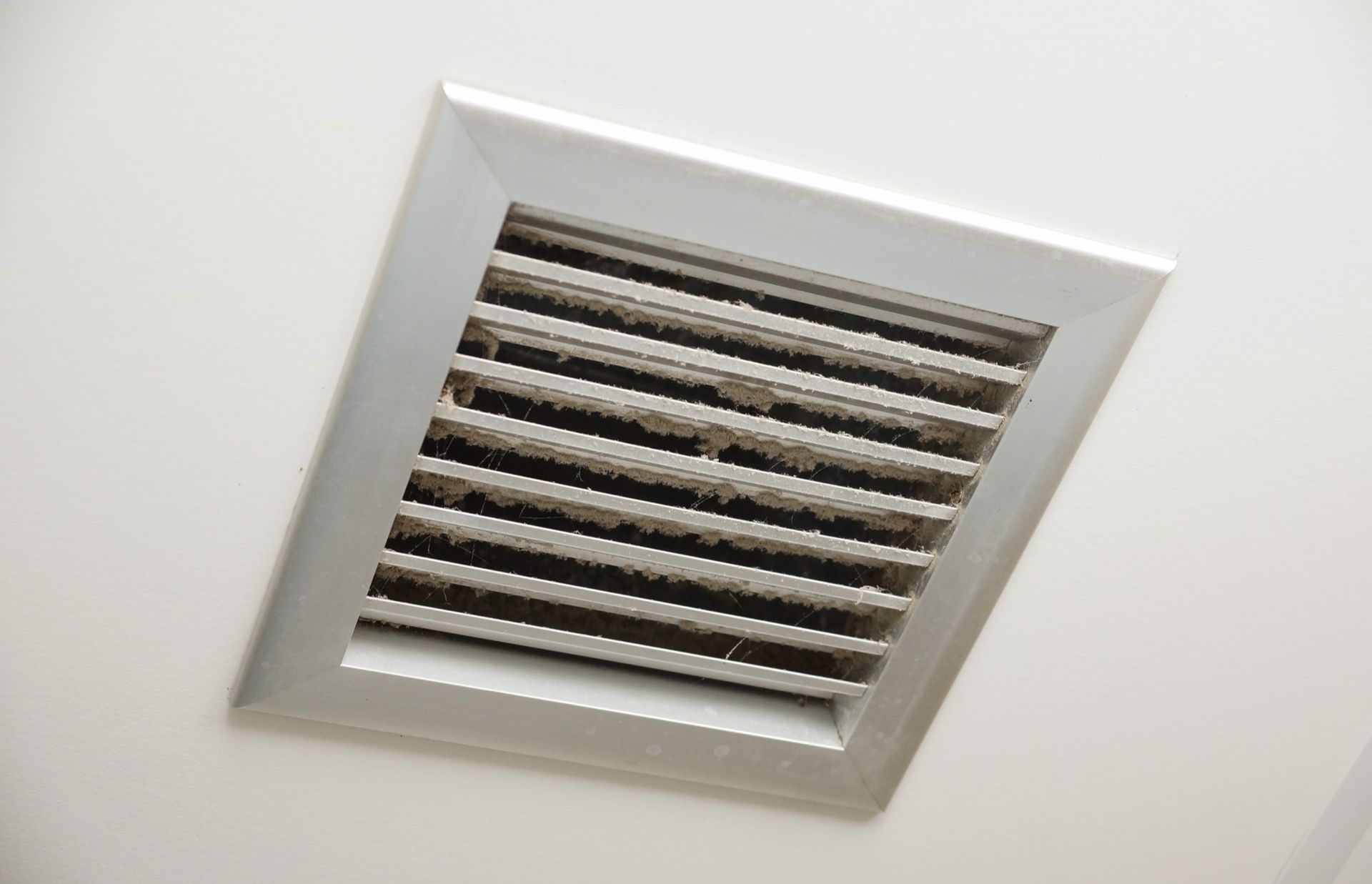dreamstime_xxl_107848003 Looking through the vents of an AC unit a fan blade stays motionless