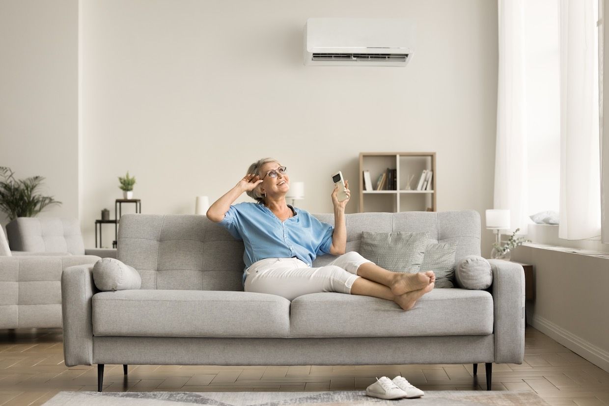 Looking through the vents of an AC unit a fan blade stays motionless