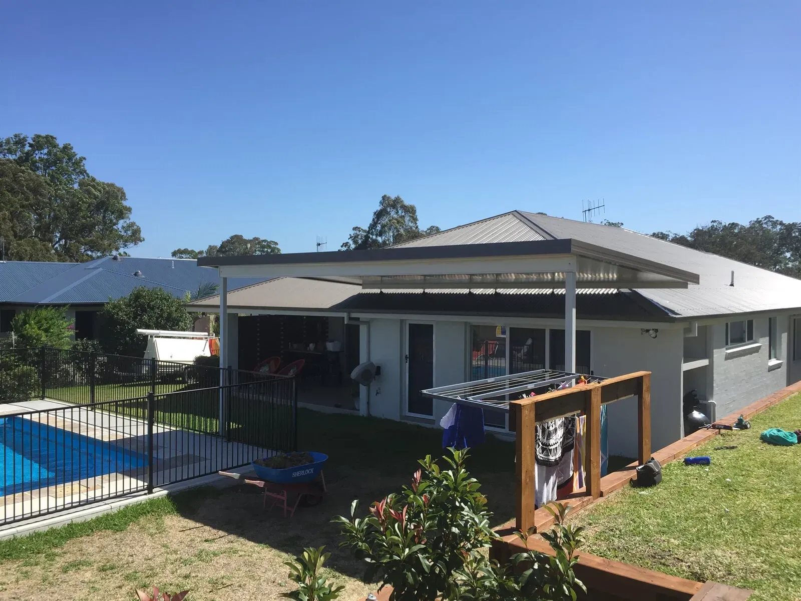 A house with a swimming pool in the backyard — Hunter & Mid Coast Patios In Hamilton, NSW