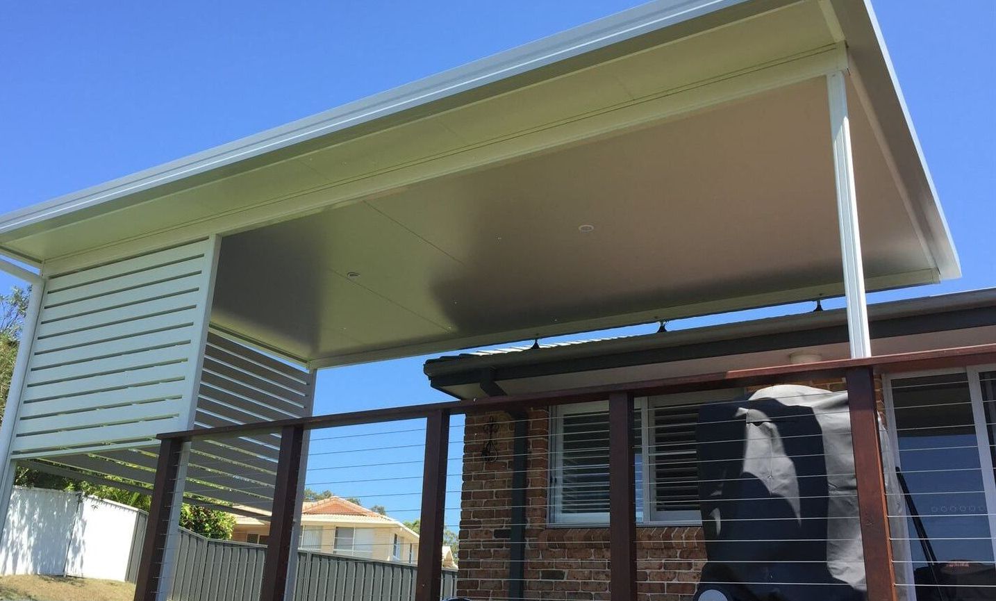 A house with a covered deck and a roof — Hunter & Mid Coast Patios In Hamilton, NSW