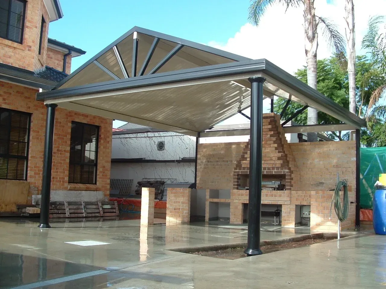 A barbecue area with a large patio over it — Hunter & Mid Coast Patios In Hamilton, NSW
