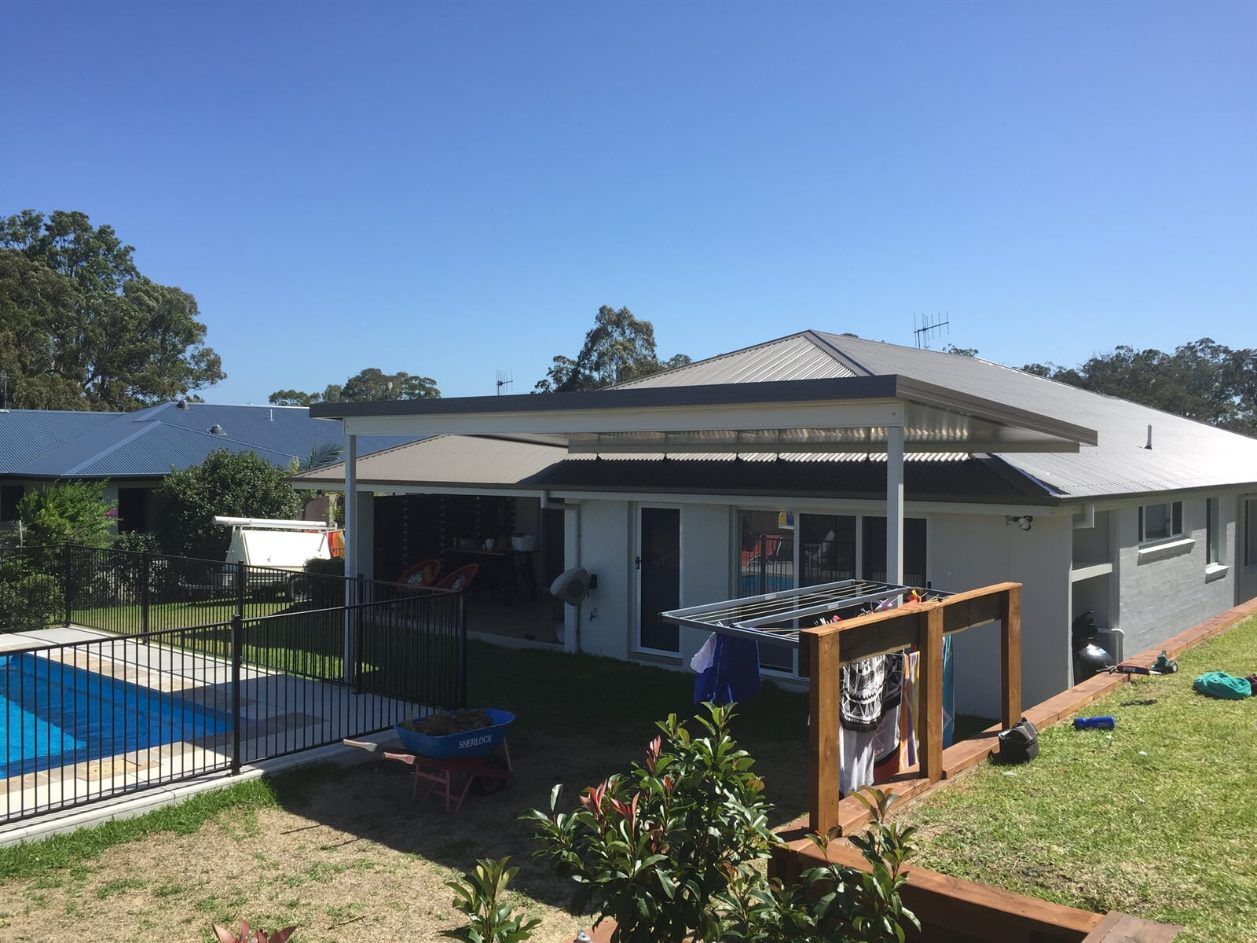An Aerial View of a Residential Area Next to a Body of Water — Hunter & Mid Coast Patios In Hamilton, NSW