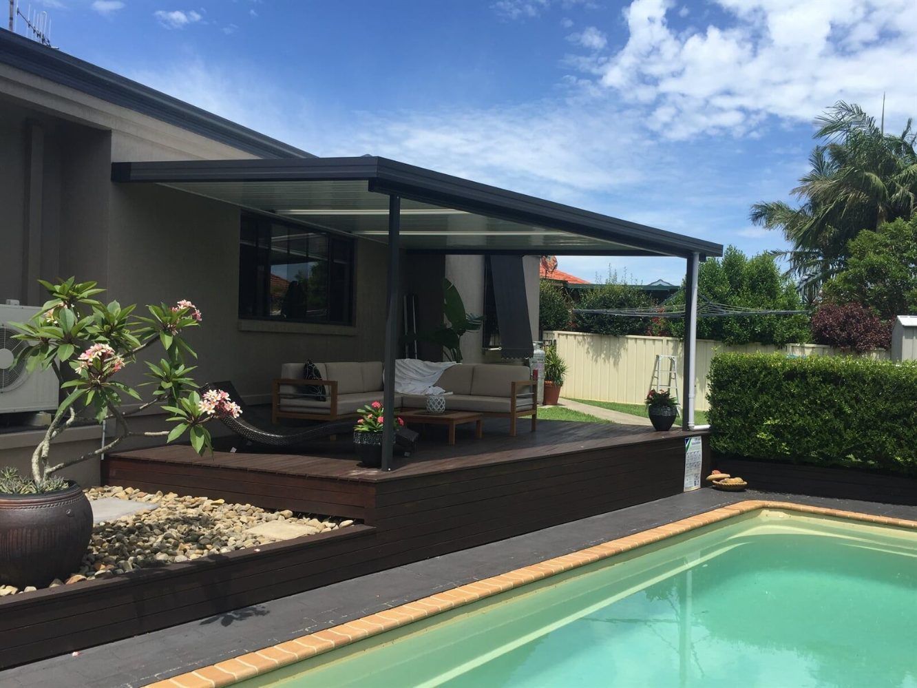 A House With a Large Deck and Stairs Leading Up to It — Hunter & Mid Coast Patios In Forster-Tuncurry, NSW