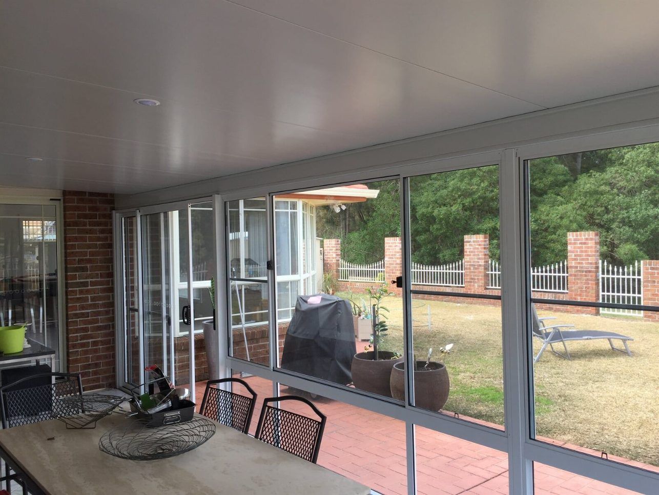 A House With a Large Deck and Stairs Leading Up to It — Hunter & Mid Coast Patios In Hamilton, NSW