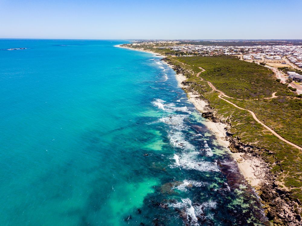 An Aerial View of a Beach With Turquoise Water — Gardners Yamba Skip Bin Hire in Iluka, NSW