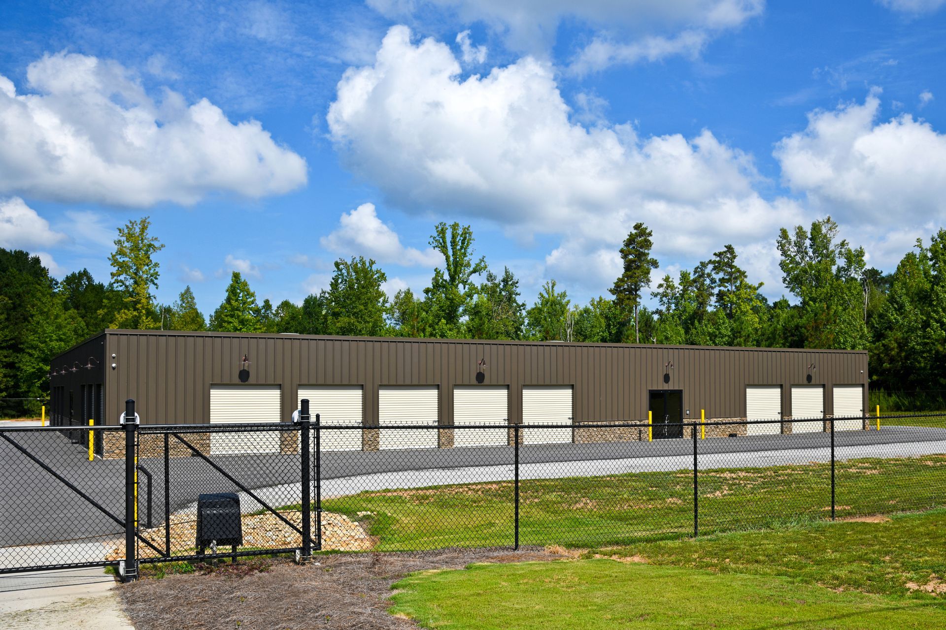 A large building with a chain link fence in front of it.
