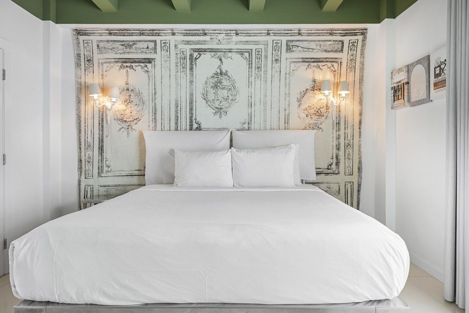 Superior King room with king bed and Art Deco panelled headboard