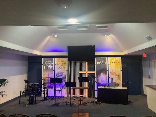 A church with a large screen on the wall that says life