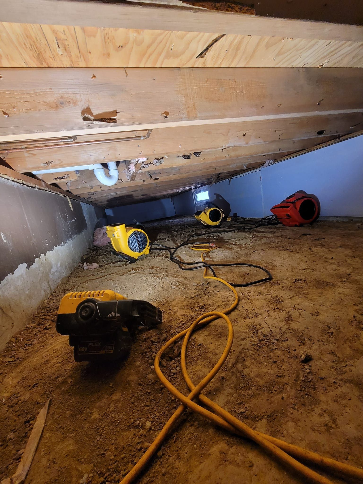A bunch of tools are sitting under a ceiling in a room.