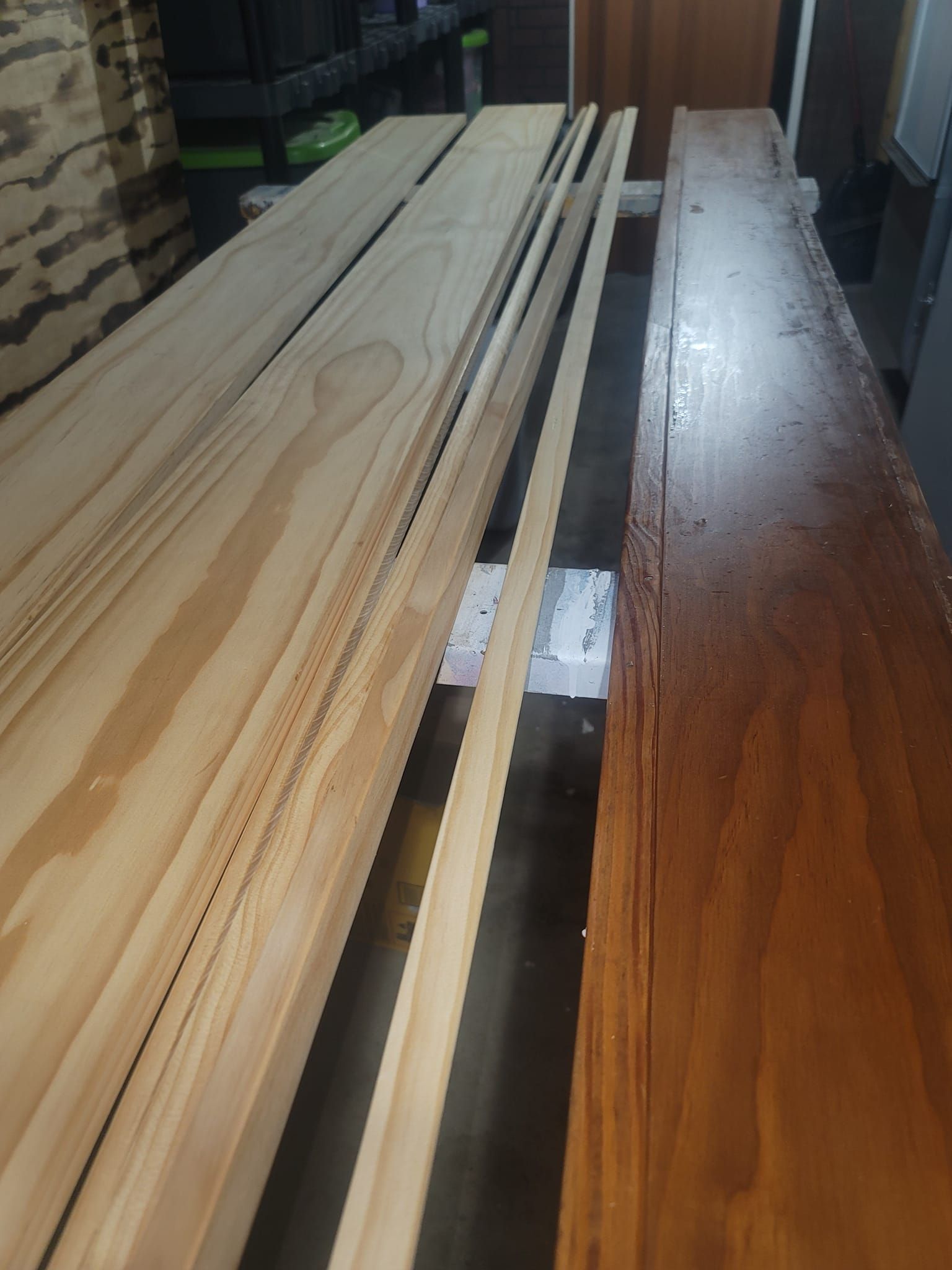 Two pieces of wood are sitting next to each other on a table.