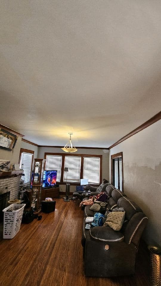 A living room filled with furniture and a fireplace.