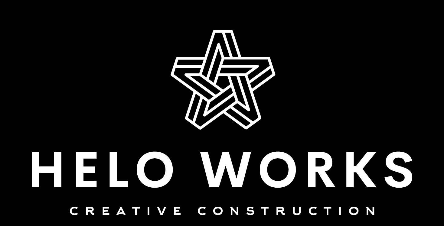 The logo for helo works creative construction has a white star on a black background.