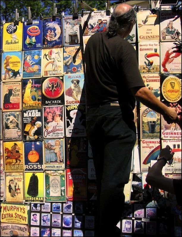 Shopkeeper Hanging Posters — Tampa, FL — Gegan Law Office Shopkeeper Hanging Posters — Tampa, FL — Gegan Law Office