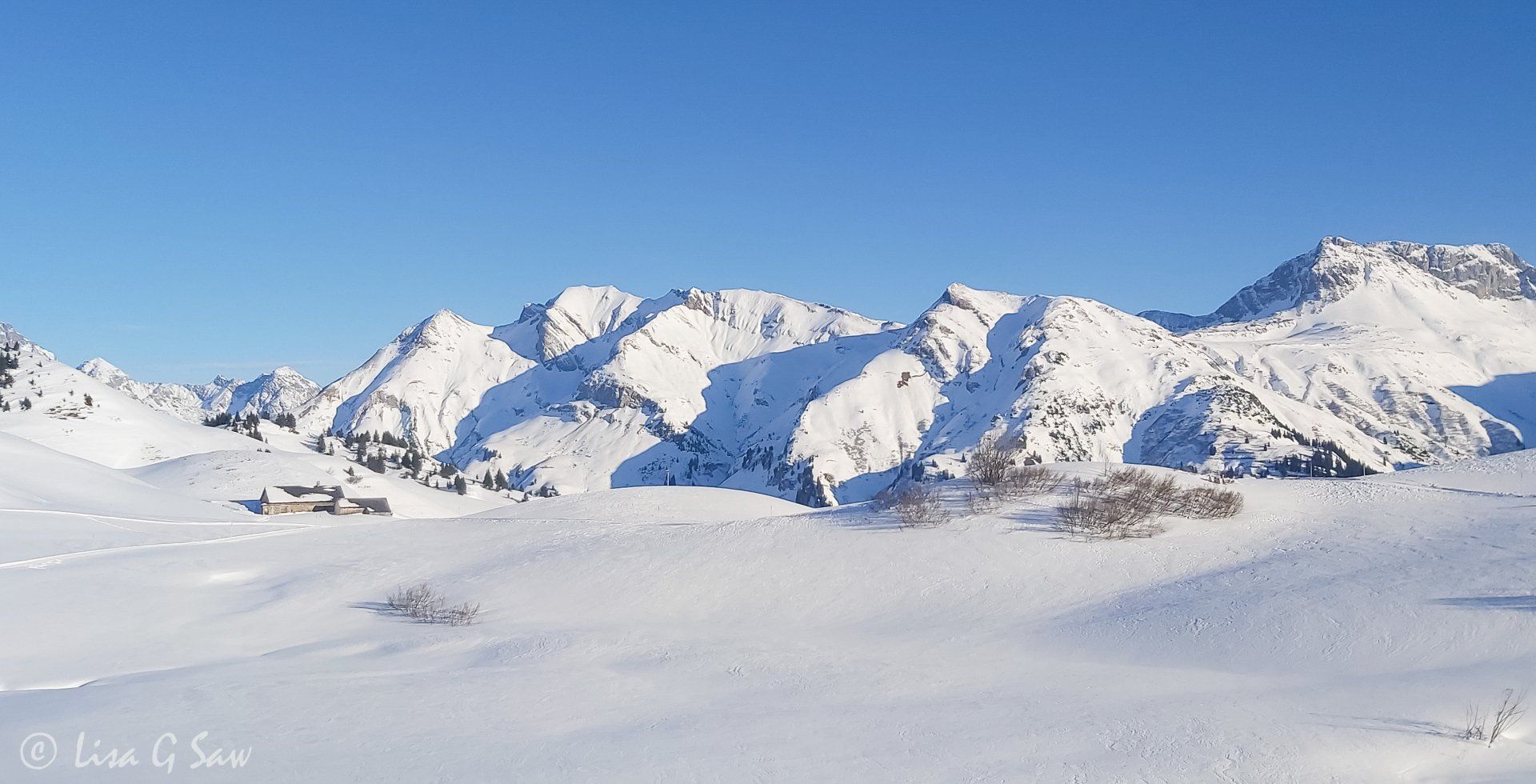 Snow covered mountains panoramic view from lift