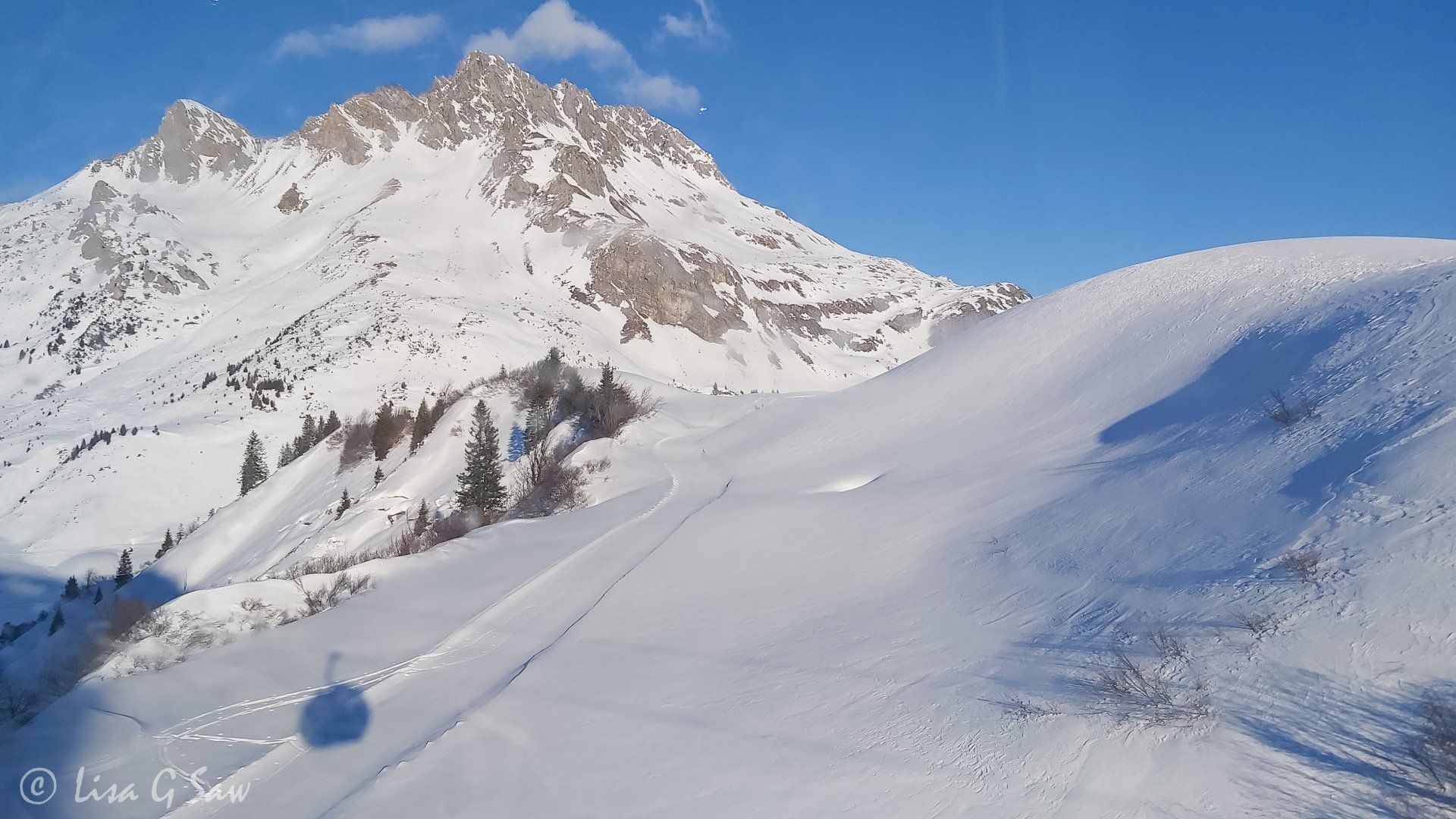 Snow covered mountains with reflection of bubble