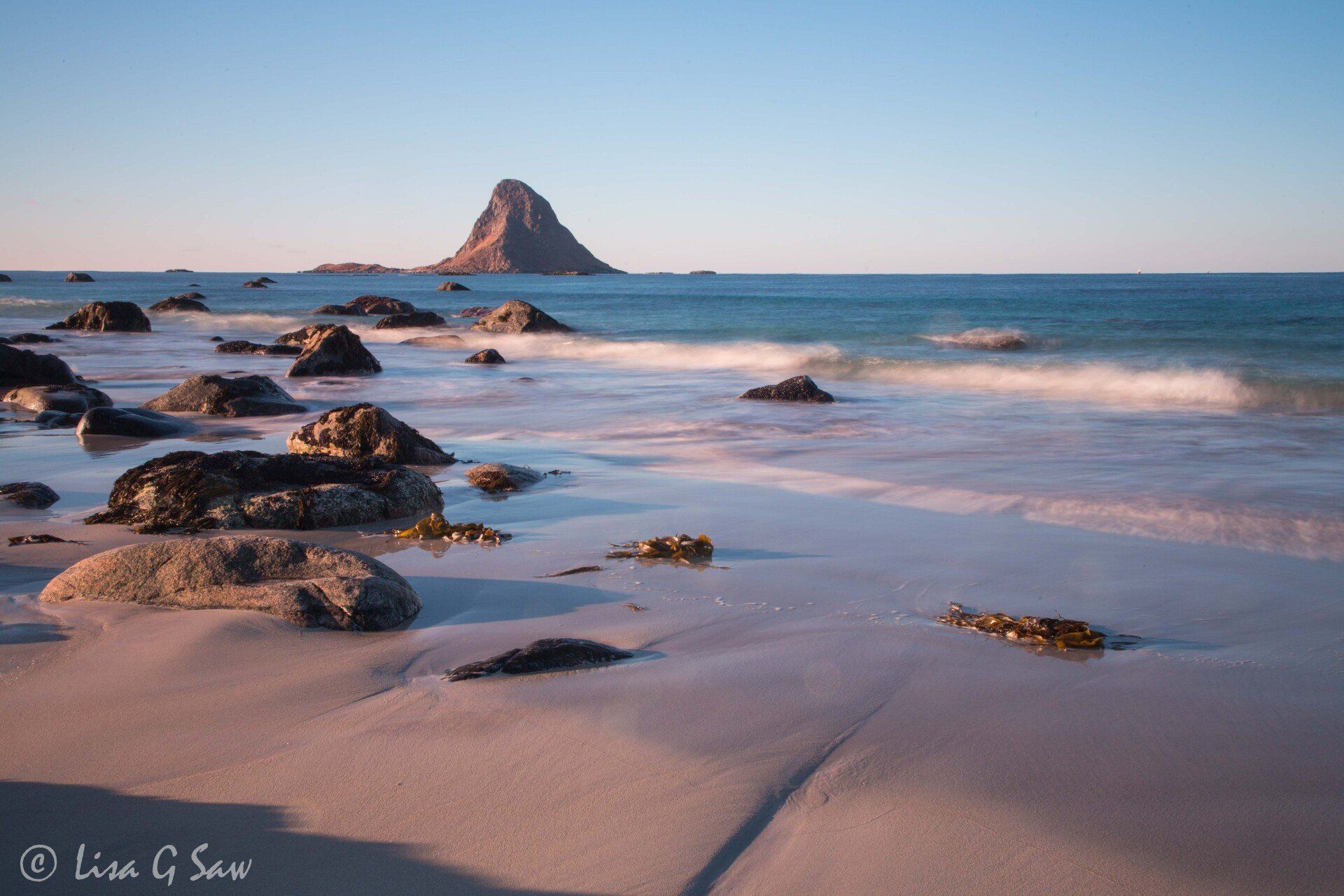 Beach with rocks and slow motion effect with tide