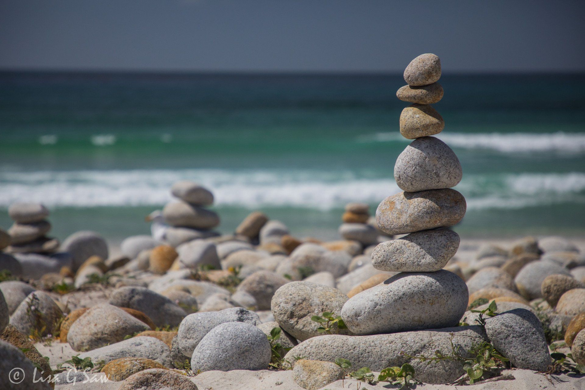 Cairns and turquoise water, Spanish Bay