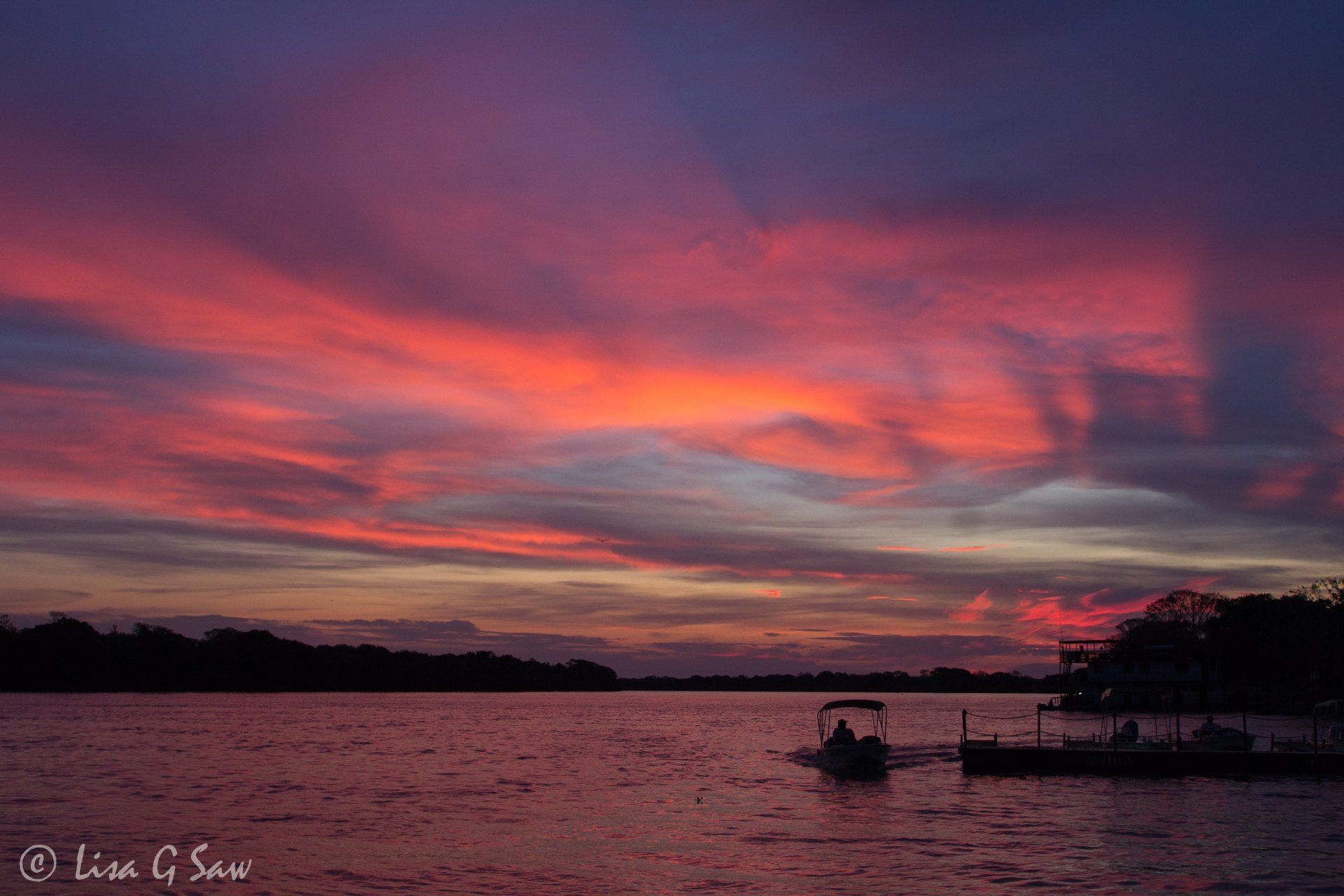 Speed boat coming in to dock at sunset, Porto Jofre