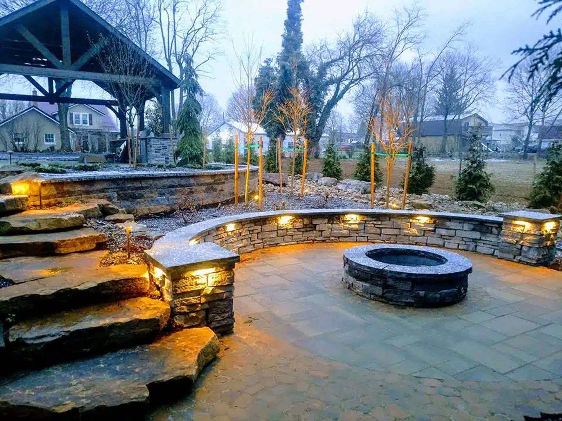 There is a fire pit in the middle of the patio.