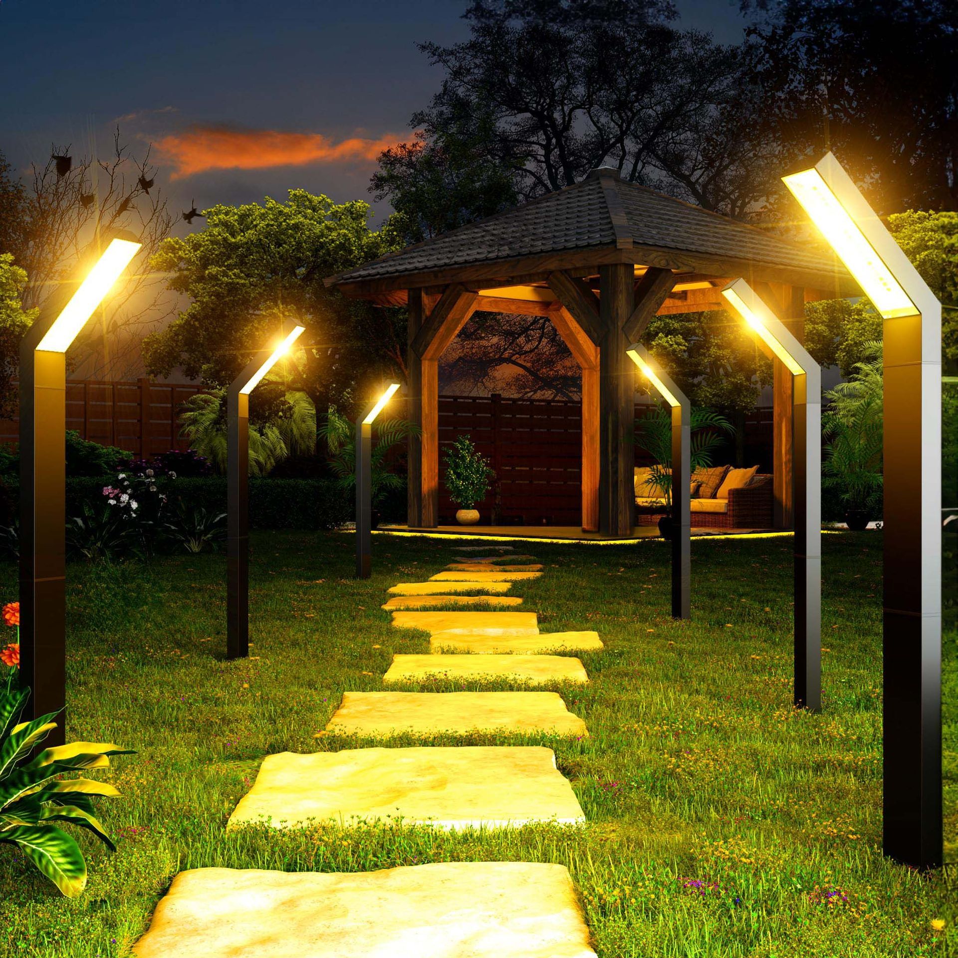 A path leading to a gazebo is lit up at night