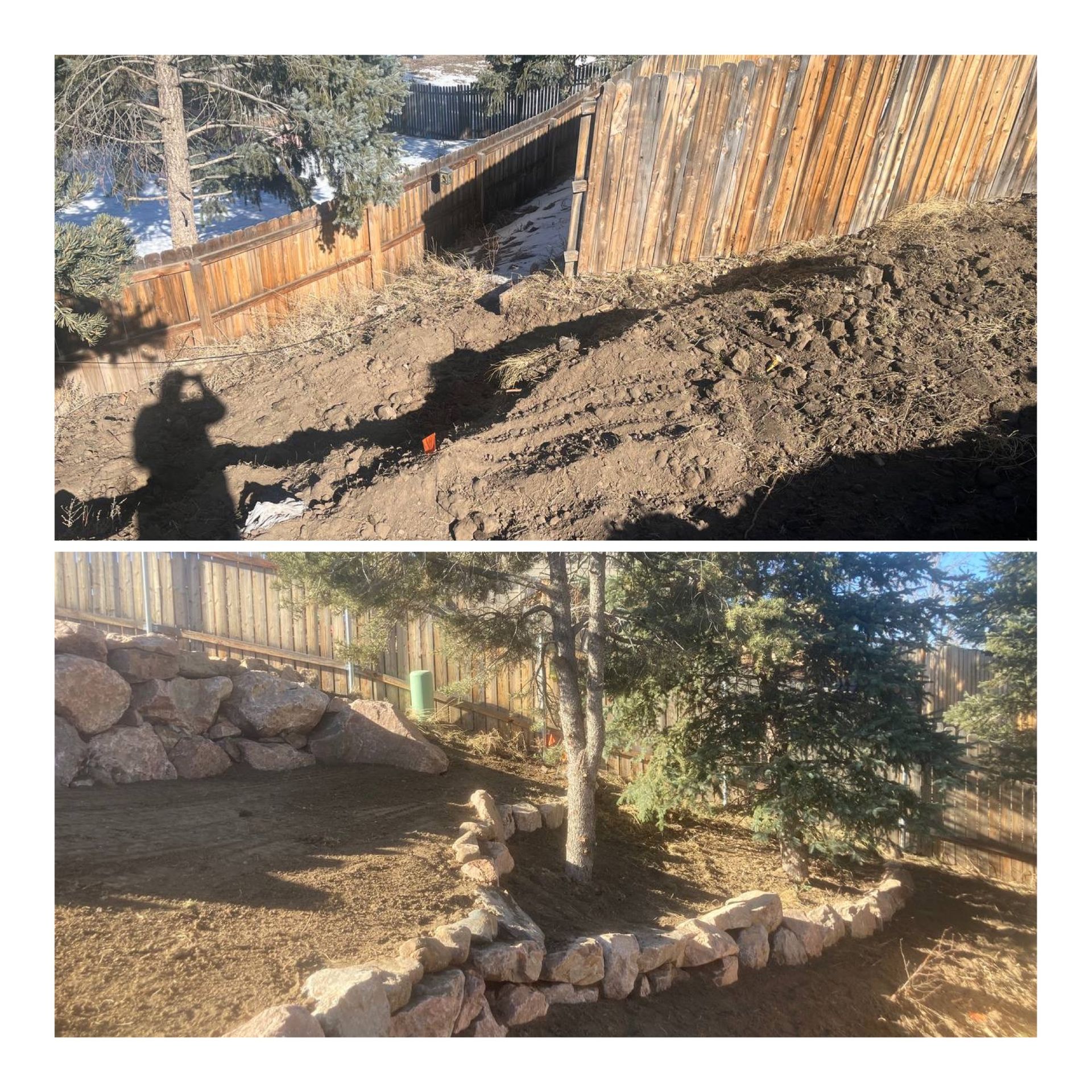 Backyard hillside landscaping with wooden retaining wall and rock border in sunlight