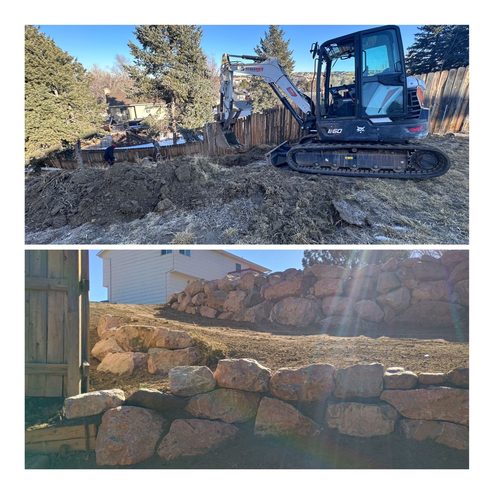 Excavator on a dirt slope above stacked stone retaining walls in a sunny outdoor construction site