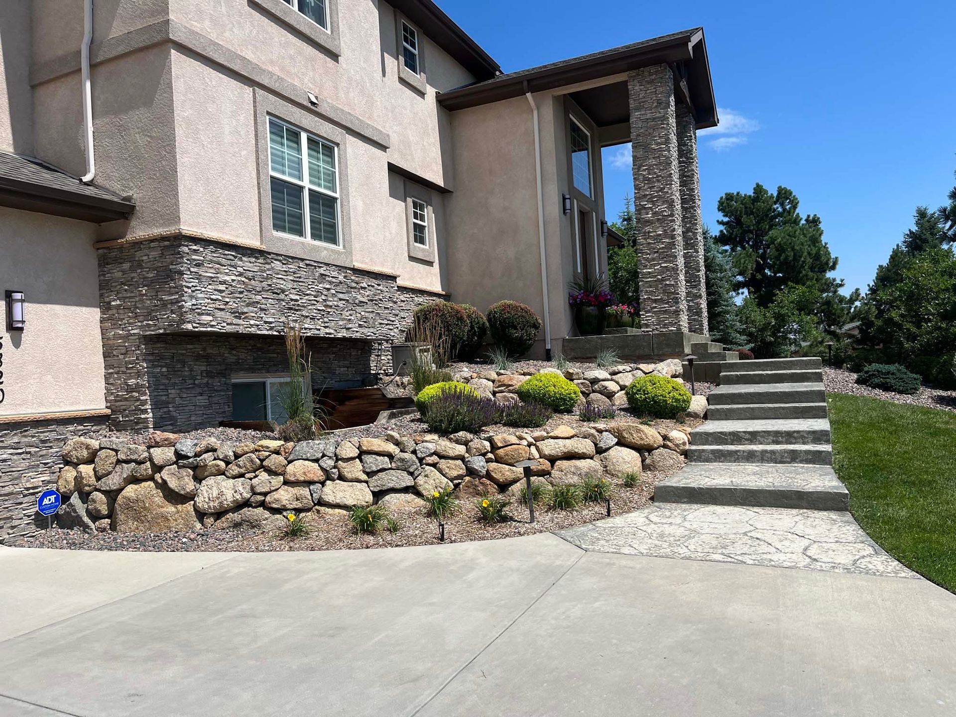 A large house with stairs leading up to it