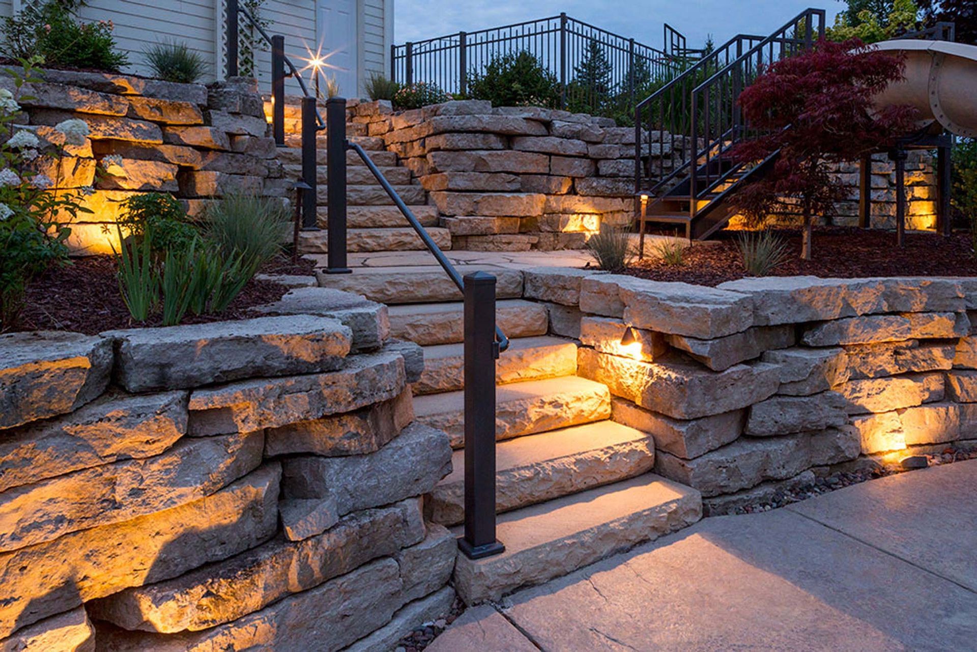 A stone wall with stairs leading up to it