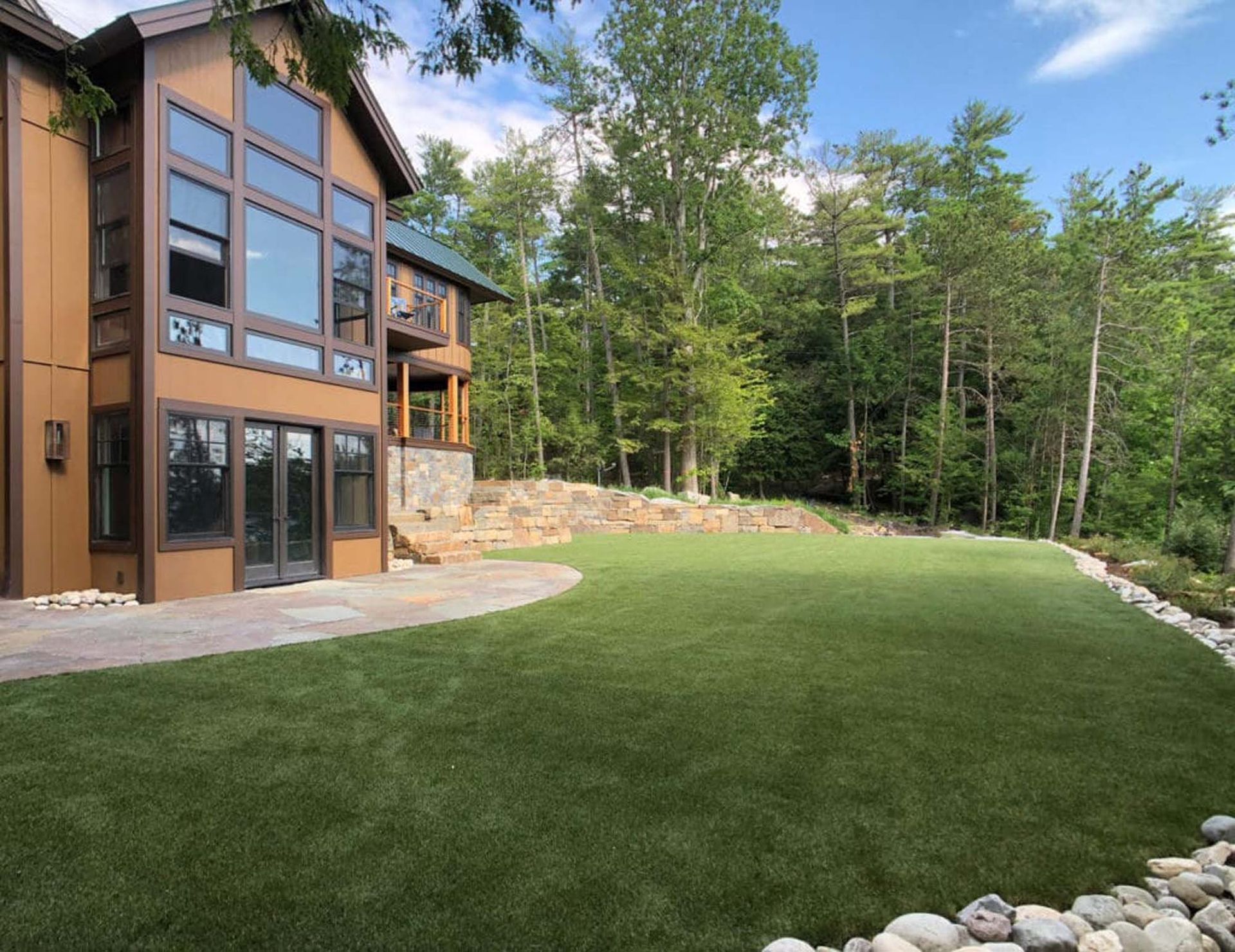 A large house with a large lawn in front of it