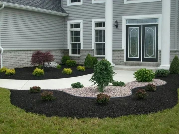 A house with a walkway leading to the front door