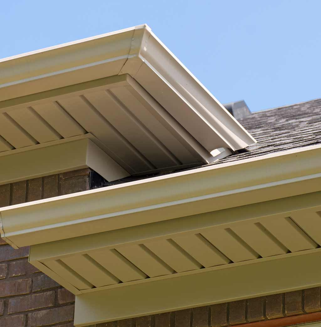 A house with a roof that has a gutter on it