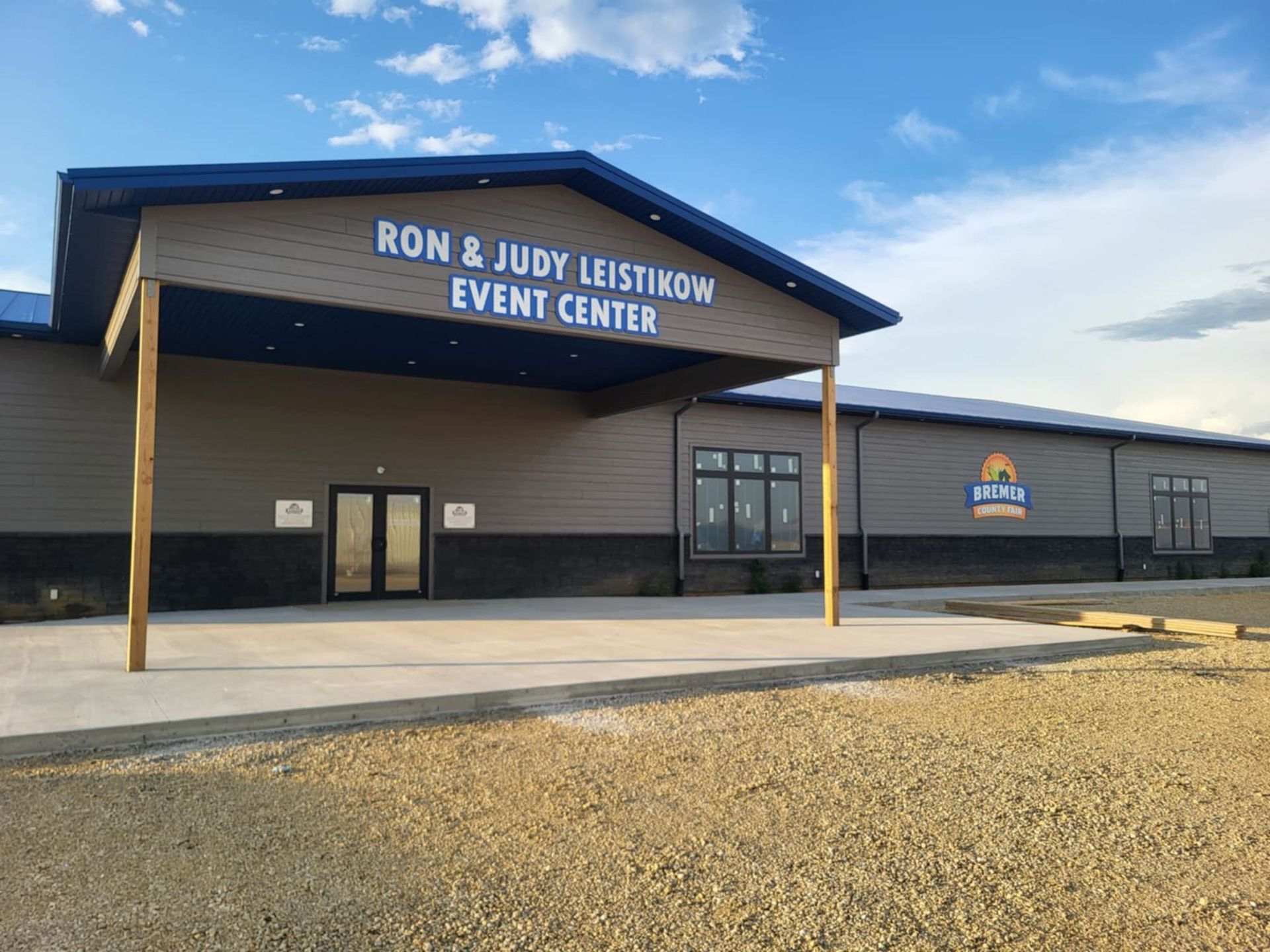 Ron & Judy Leiskow Event Center building with covered entrance and clear blue sky