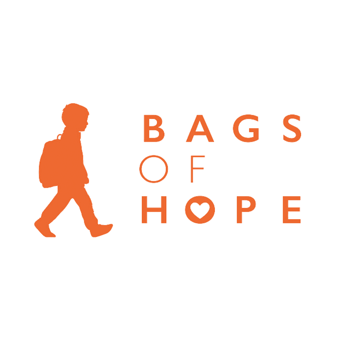 Orange silhouette of a child with a backpack, walking next to