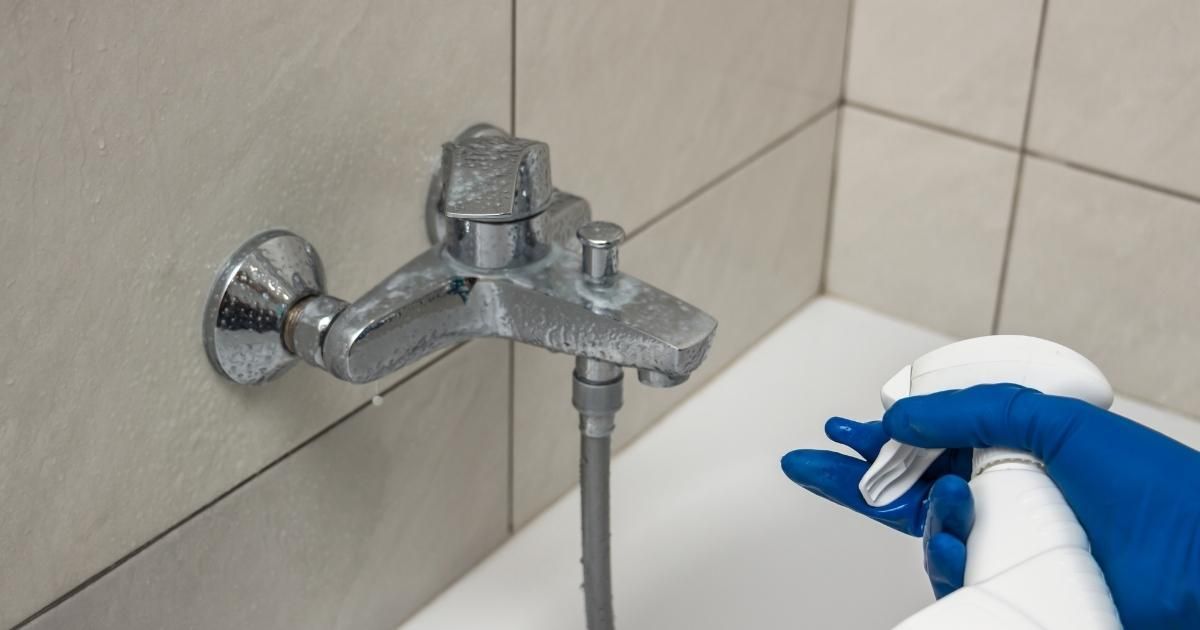 Preparing to clean a faucet.