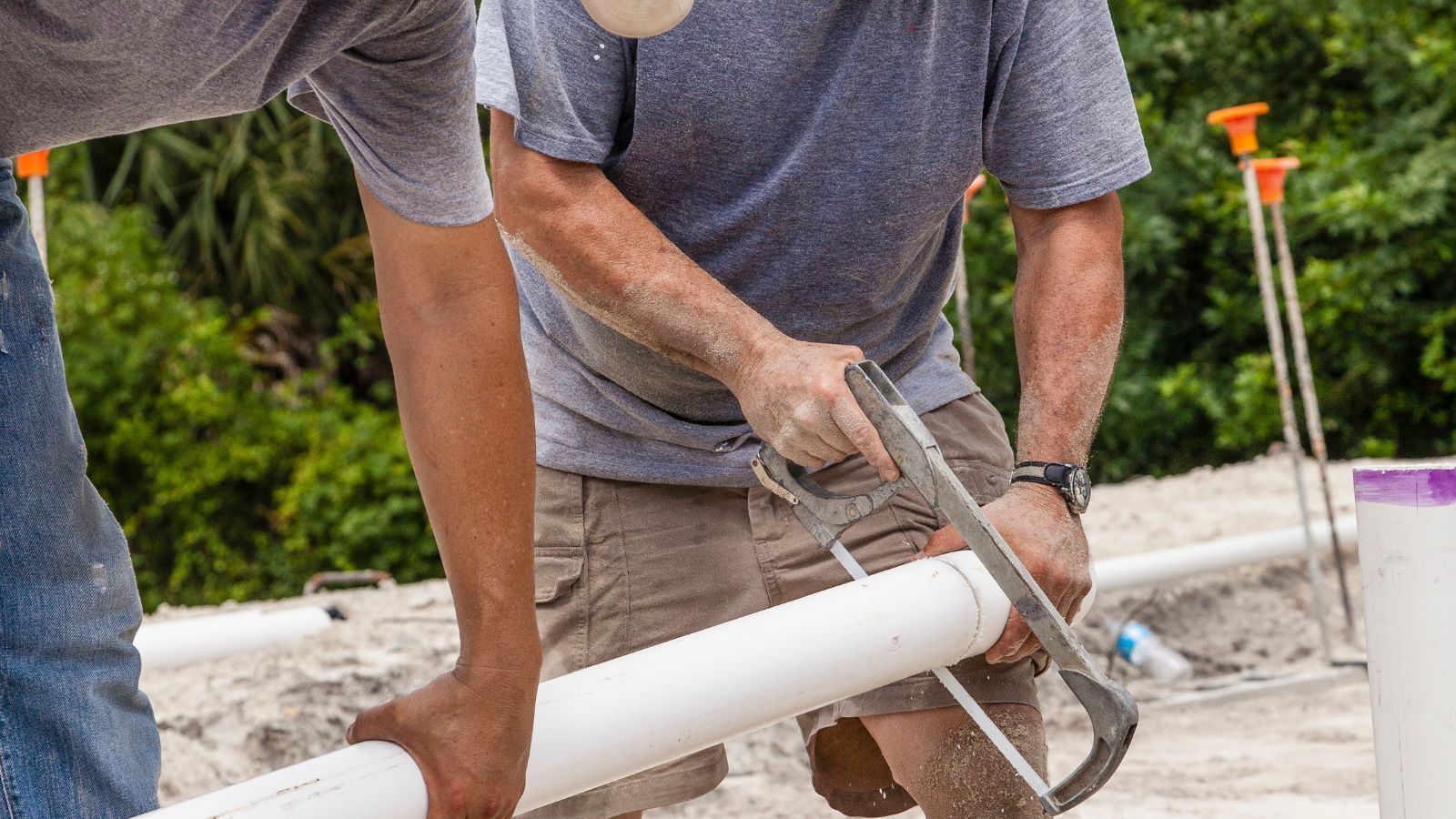 2 men replaceing a sewer line