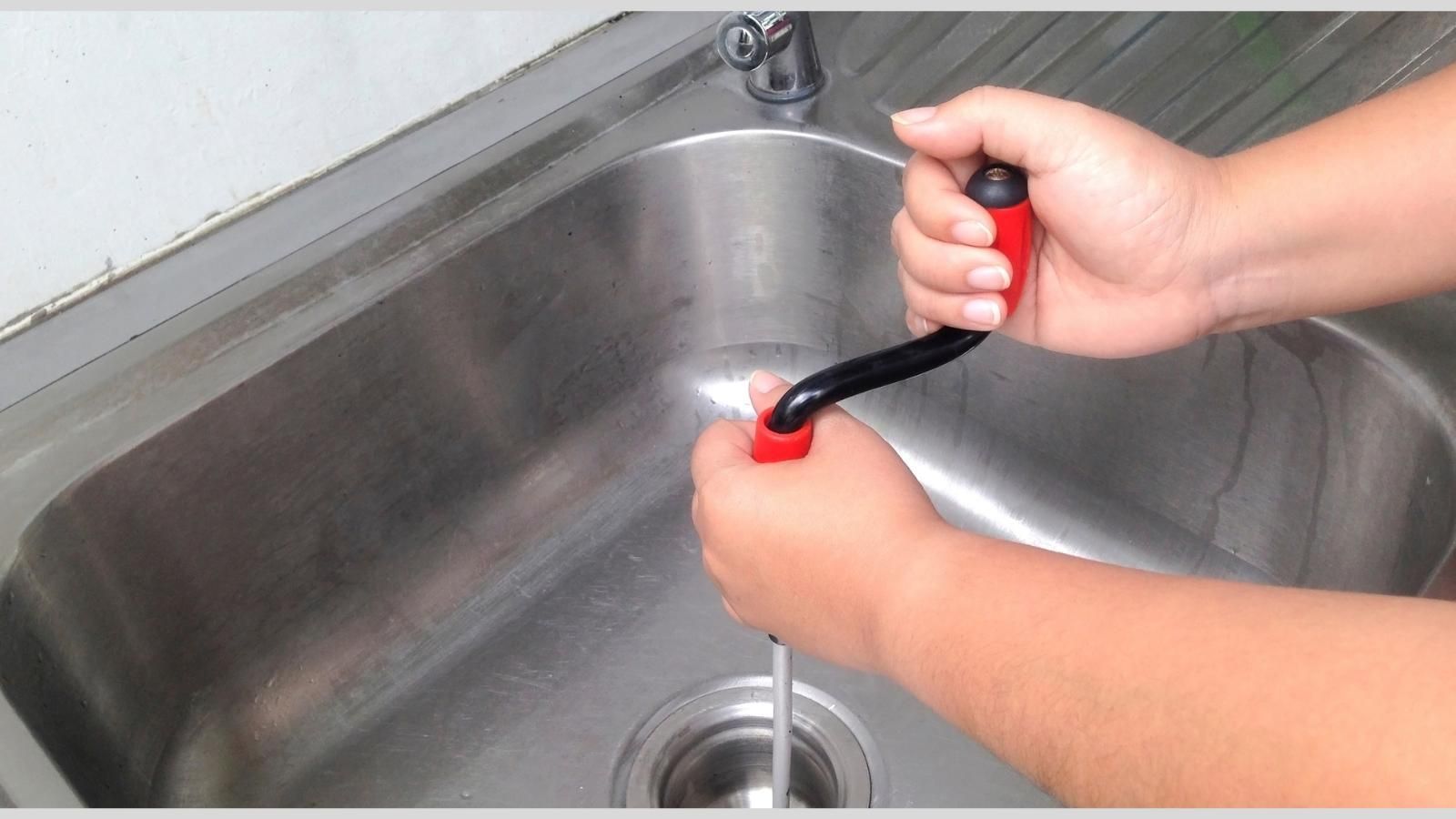 Snaking a sink drain.