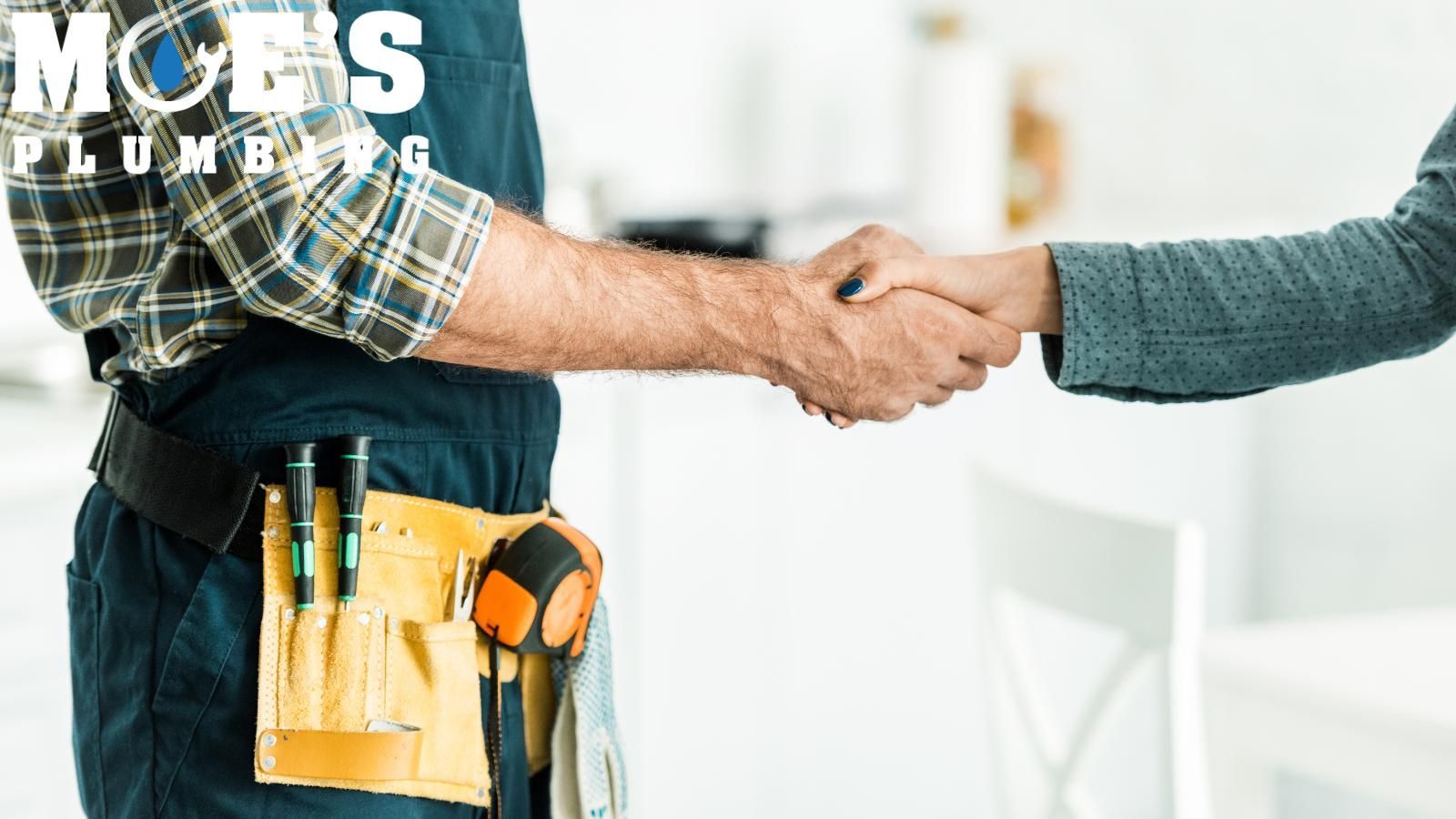 cleaning out sewer lines sewer cleaning tech shaking hands with client