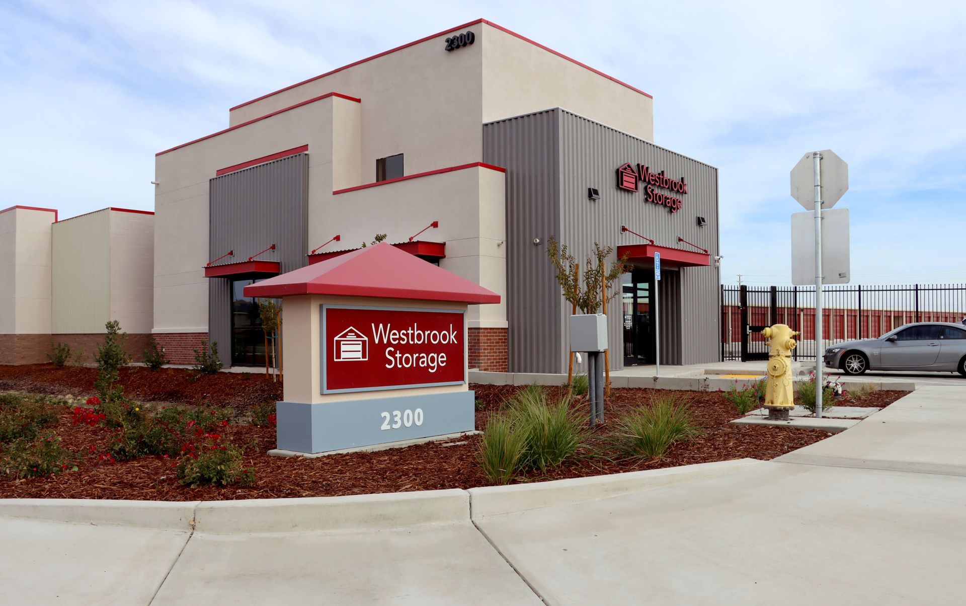 A building with a red sign that says westbrook storage
