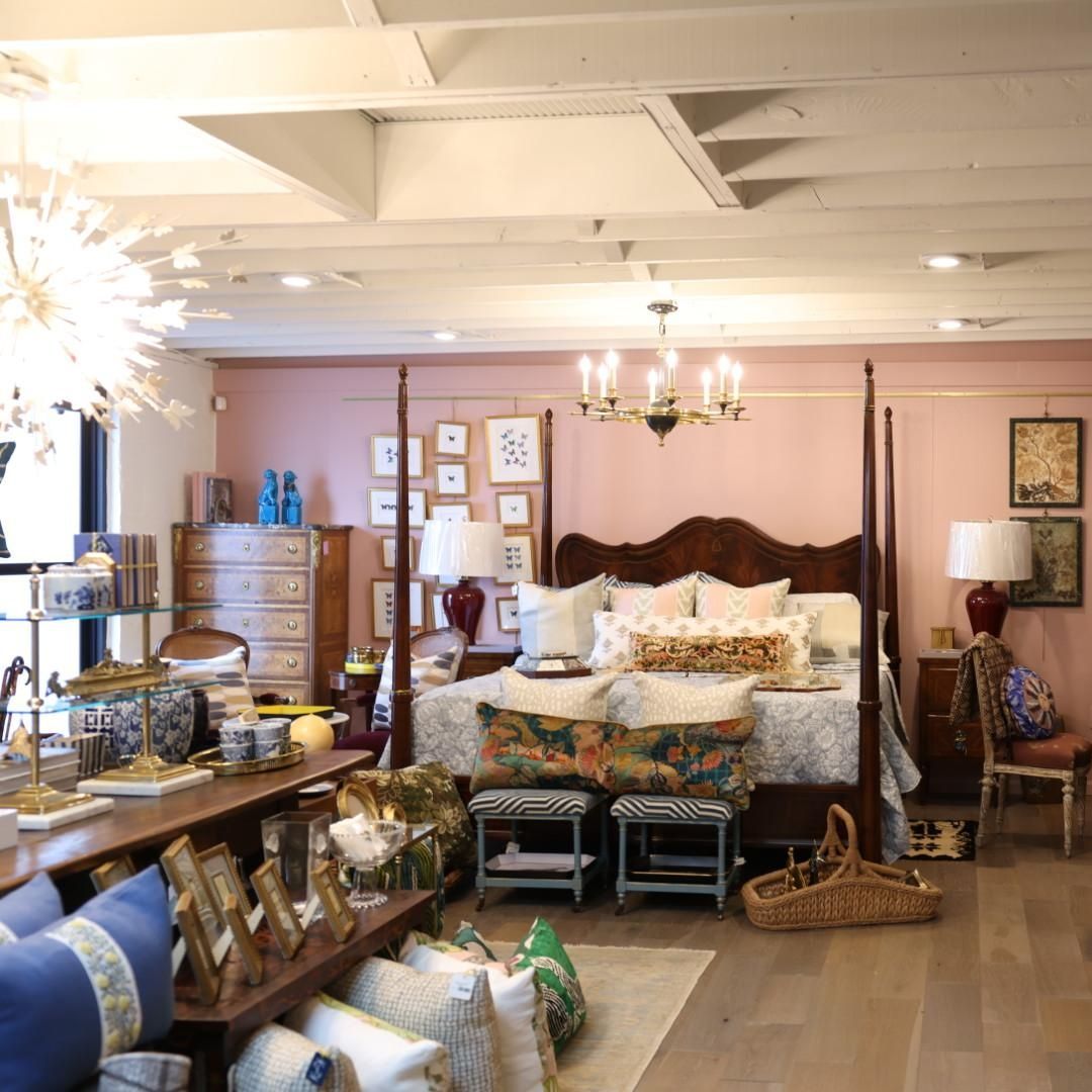 Cozy bedroom with accent pillows, chandelier, and custom furniture – interior upgrade and repairs.