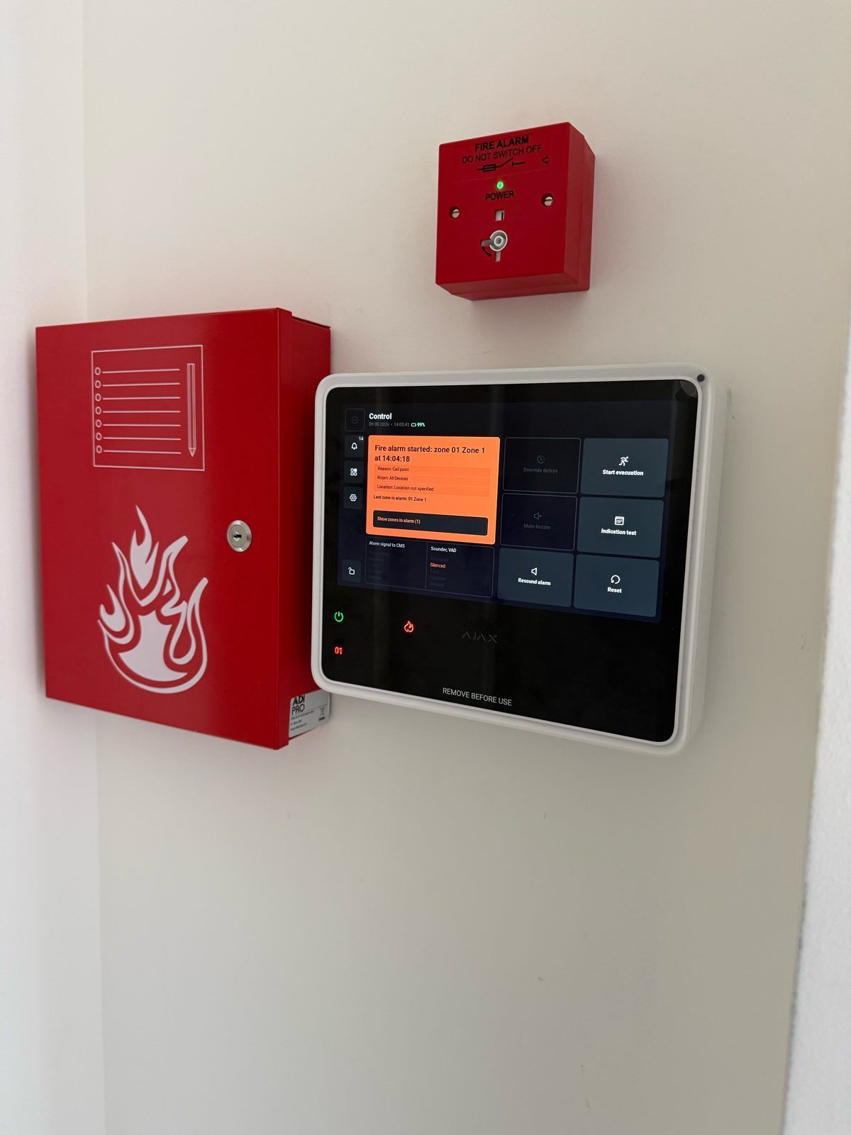 Fire alarm control panel and red call point installed by Crystal Smart & Security