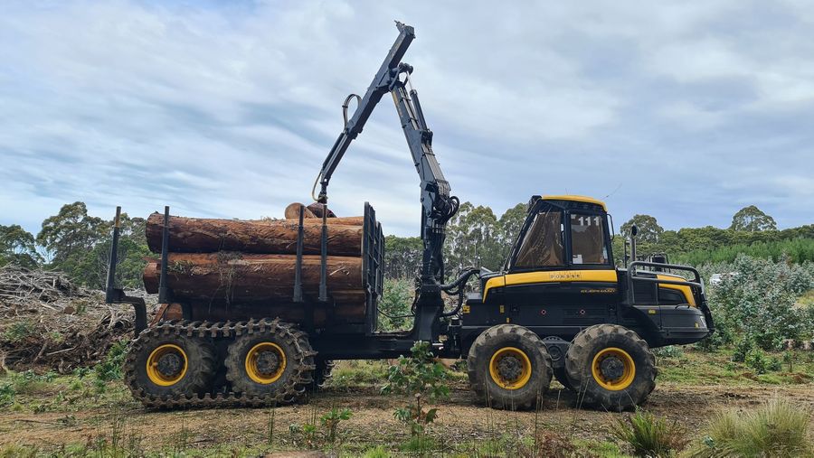 Robert Kerrison in digger with his son Dwayne on his knee.