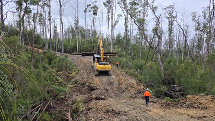 Robert Kerrison fixing the track of a machine