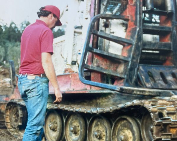 Robert Kerrison fixing the track of a machine