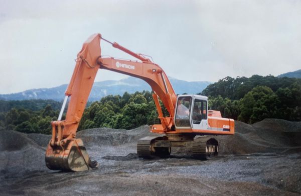 old photo of an orange digger